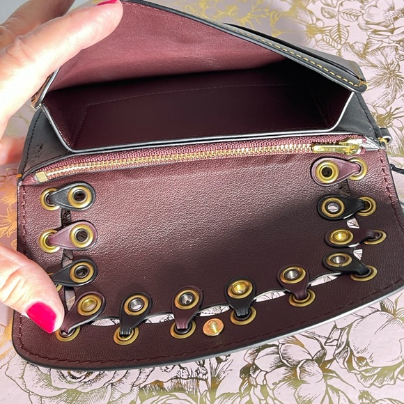 Clutch With Colorblock Coach Link Details
